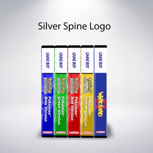 May include: A selection of Game Boy game cartridges, including Pok&eacute;mon Blue, Green, Red, Yellow versions, and Warioland. The spines are colour-coded and feature the game titles and logos. The text "Silver Spine Logo" is at the top.