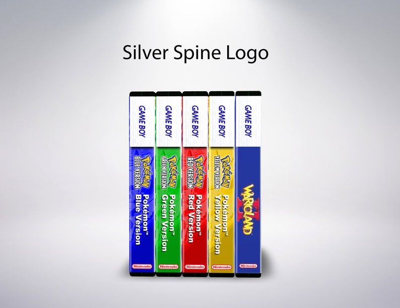 May include: A selection of Game Boy game cartridges, including Pok&eacute;mon Blue, Green, Red, Yellow versions, and Warioland. The spines are colour-coded and feature the game titles and logos. The text "Silver Spine Logo" is at the top.