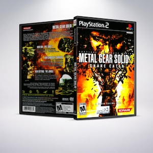 以下が含まれることがあります： メタルギアソリッド3 スネークイーターのPlayStation 2用ゲームケース。ケースは黒で、黄色とオレンジのデザイン。ゲームのタイトルはケースの前面に白で印刷されています。ゲームはM指定です。