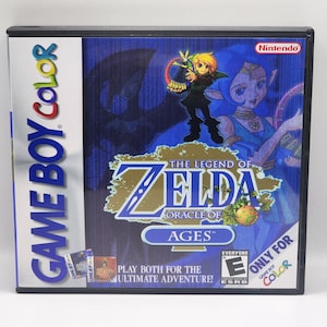 May include: Game Boy Color game cartridge for The Legend of Zelda: Oracle of Ages. The cartridge is blue and green with a picture of Link and a fairy on the front. The text "The Legend of Zelda: Oracle of Ages" is printed in gold on the front of the cartridge.
