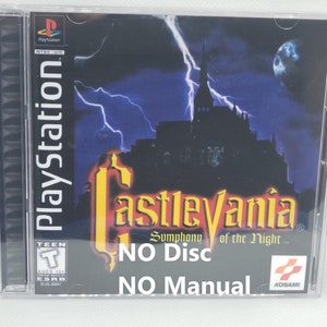 May include: A PlayStation game case for Castlevania: Symphony of the Night. The case is black with a picture of a castle and lightning bolts. The text "NO Disc" and "NO Manual" is printed on the case.