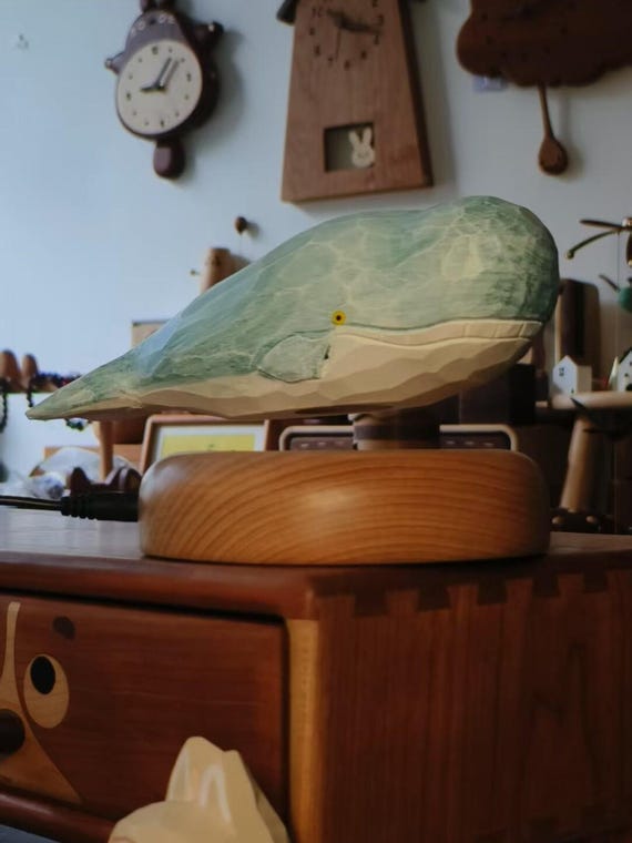 A hand-carved wooden whale that genuinely levitates via magnetic base — 211 favorites make this the runaway star of the batch and an instant conversation piece.