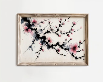 May include: Watercolour painting of a cherry blossom branch in a wooden frame. The artwork features pink and white blossoms, black branches, and grey ink splatters on a beige background.
