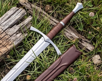 May include: A steel sword with a double-edged blade, a silver crossguard, and a brown leather-wrapped grip featuring a silver pommel. The sword is accompanied by a matching brown leather scabbard with a contoured opening.