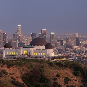 Panoramic photo of Griffith Park Observatory with Downtown Los Angeles in the background