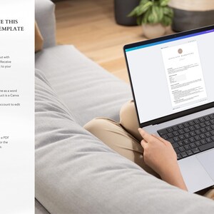 May include: A laptop computer displaying a Canva template for a certificate. The text on the screen reads "Certificate of Completion". The laptop is on a person's lap, and the person is sitting on a couch.