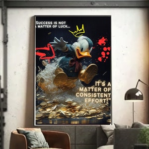 May include: A motivational poster featuring a cartoon duck wearing a blue jacket and a red bow tie, jumping over a pile of gold coins. The poster has the text "SUCCESS IS NOT A MATTER OF LUCK... IT'S A MATTER OF CONSISTENT EFFORT!" in yellow and red.