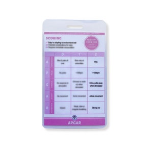 May include: A clear plastic medical reference card with a pink and white design. The card features the APGAR scoring system, with sections for Appearance, Pulse, Grimace, Activity, and Respiration. Text includes scoring criteria and assessment times.