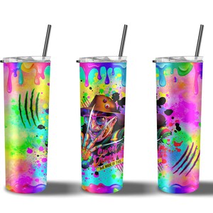 May include: Three stainless steel tumblers with colorful paint splatter designs. The center tumbler features a graphic of a character with a knife and the text "Sweet Dreams Are Made Of This".