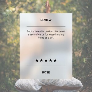 Image of yogi in a yoga pose, with words of a review reading 'Such a beautiful product.  I ordered a deck of cards for myself and my friend as a gift.'