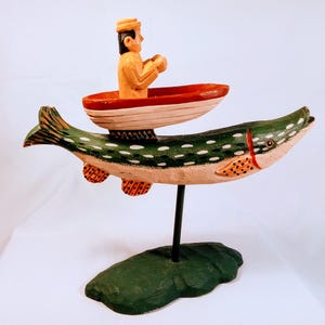 Vintage Fisherman Figurine: Rustic Wood Fish Decor
