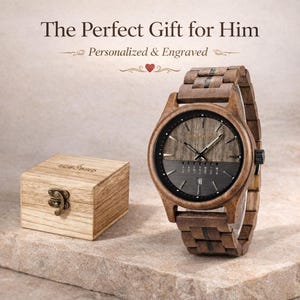 May include: A wooden watch with a dark gray face and a wooden band sits next to a small wooden box. The watch face has the brand name "BOBO BIRD" and the box also has the brand name. The watch has a date display.