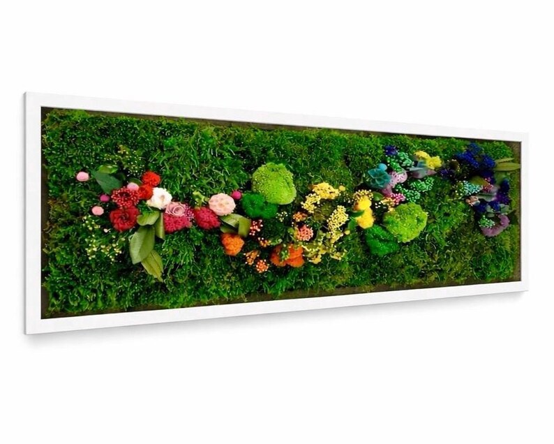 May include: A rectangular wall art piece featuring a vibrant green moss background. Colorful flowers and plants are arranged across the moss, framed by a white border. The floral arrangement includes red, pink, orange, yellow, and blue hues.
