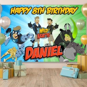May include: A blue and green birthday banner featuring the Wild Kratts characters, a cheetah, and a rhino. The banner says "Happy 8th Birthday Daniel".