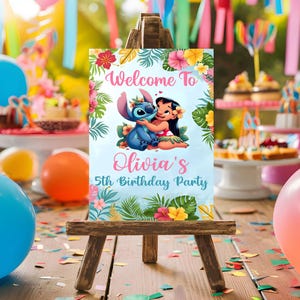 May include: A blue and pink welcome sign with a cartoon image of Stitch and Lilo. The sign says "Welcome to Olivia's 5th Birthday Party".