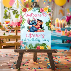 May include: A blue and pink welcome sign with a cartoon Stitch and Lilo from Disney's Lilo & Stitch. The sign says "Welcome to Olivia's 5th Birthday Party".
