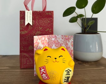 Japanese Maneki Neko yellow Lucky Cat for good fortune in finance and gift bag. Feng Shui.