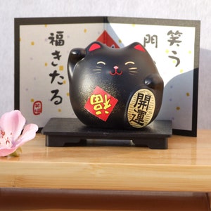 Maneki Tou, chat noir porte-bonheur japonais pour se protéger avec bonheur