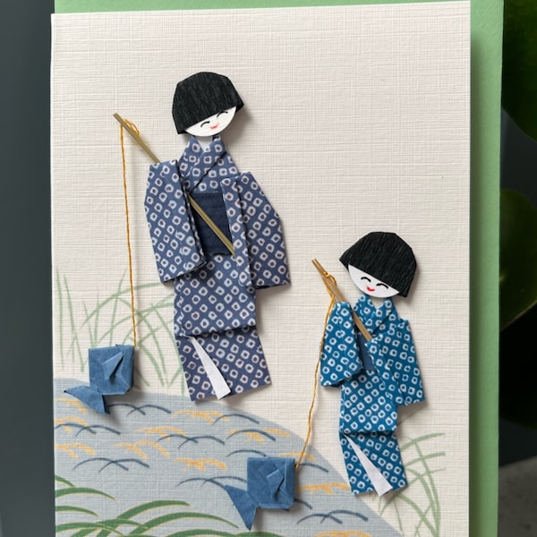 Carte faite à la main Origami japonais traditionnel homme et garçon pêchant avec du poisson en origami