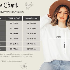 May include: Size chart for a Gildan 18000 unisex sweatshirt, showing width and length measurements in inches and centimeters for sizes S through 3XL. The chart includes a note that for a modern oversized look, choose two sizes bigger, and for a regular relaxed fit, choose your go-to size. The chart also includes a note that the model is 5'4 (162 cm) and wears size L.