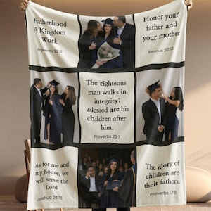 May include: A white blanket featuring multiple framed images of people in formal attire, including graduation gowns. The blanket has text from the Bible, such as "Fatherhood is Kingdom Work" and "Honor your father and your mother."