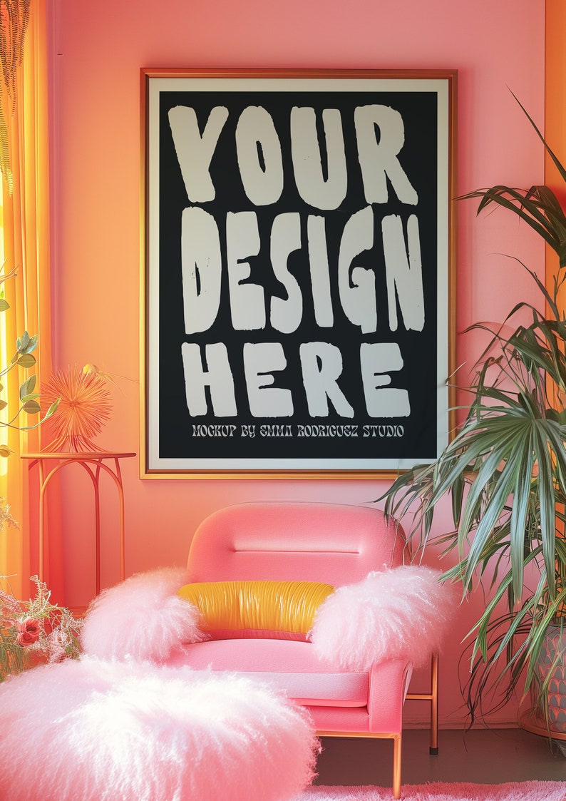 May include: A pink armchair with a fluffy white cushion and a yellow pillow. The chair is in front of a black framed poster with the text "YOUR DESIGN HERE" and the words "MOCKUP BY EMMA RODRIGUEZ STUDIO". The wall is a bright pink color.