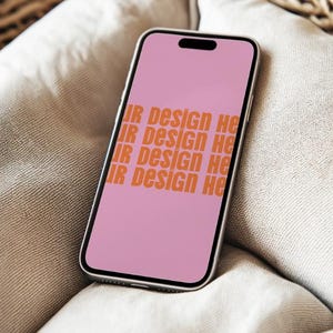 May include: A pink smartphone with a black screen displaying the text "Your Design Here" repeated four times.