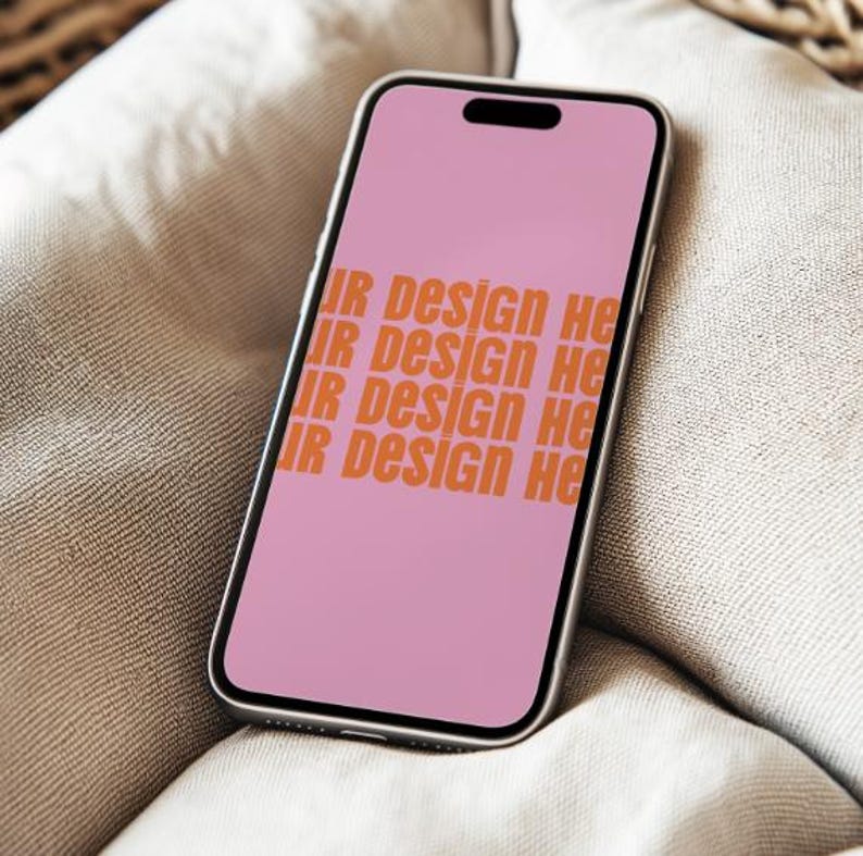 May include: A pink smartphone with a black screen displaying the text "Your Design Here" repeated four times.