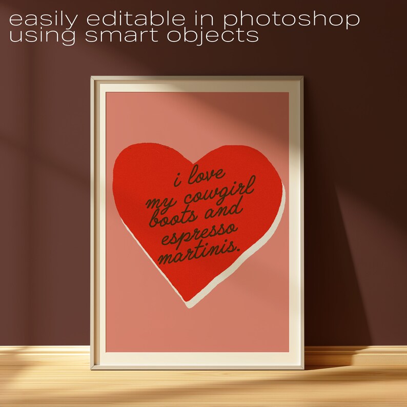 May include: A printable wall art design featuring a red heart with the text "i love my cowgirl boots and espresso martinis." The heart is on a pink background.