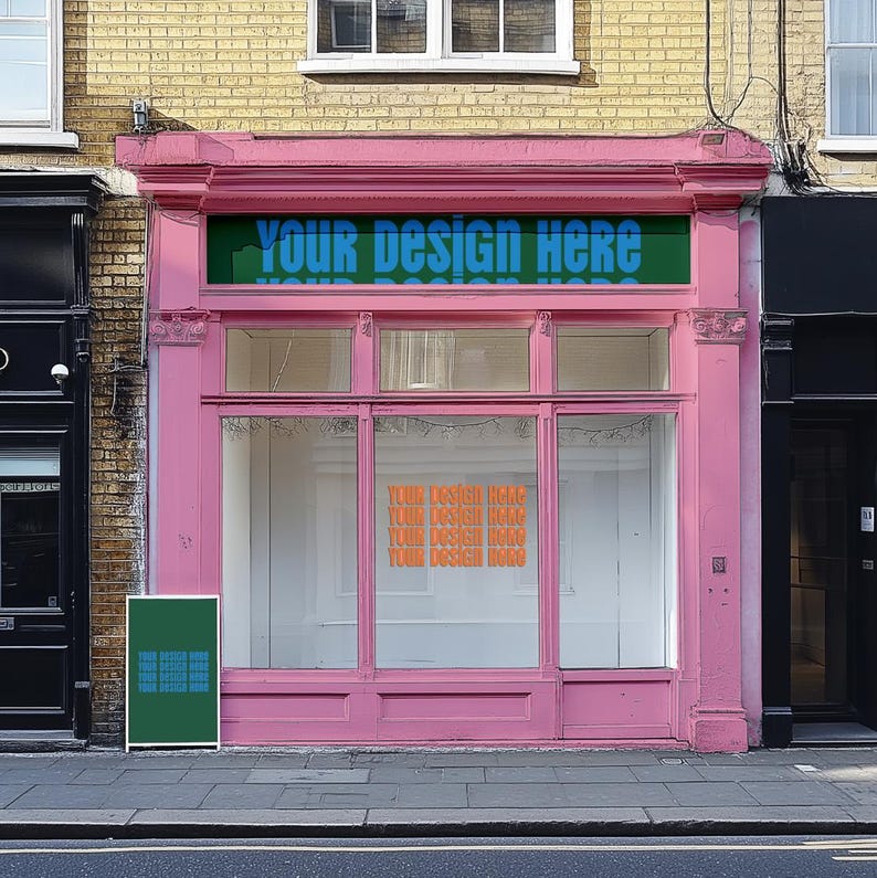 May include: A pink storefront with a large glass window display. The storefront has a sign above the window that says "Your Design Here". There is a green poster on the left side of the storefront.