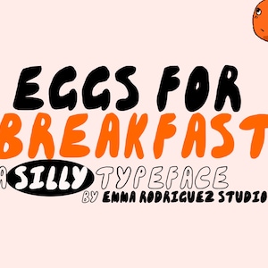 May include: A whimsical graphic design with the text "EGGS FOR BREAKFAST" in black and orange, with "A SILLY TYPEFACE" below. The design includes cartoon tomatoes and a smiling flower on a checkered background.