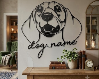 May include: A black metal wall art piece shaped like a dog head with floppy ears, featuring the text "dog name" in a cursive script below the animal's face. The design is composed of clean, continuous lines forming the canine's features.