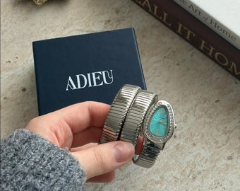 Montre serpent couleur argent avec cadran turquoise