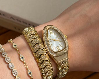 Montre serpent de luxe en pierre dorée