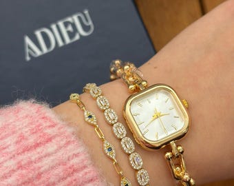 Montre dorée Tiffany pour femme