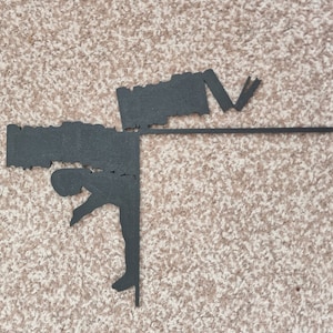 May include: Black silhouette of a person doing a handstand with a black bar across the top. The person is holding a black object in their hands.