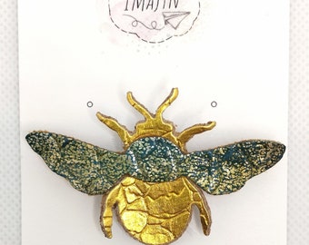 Golden scarab brooch