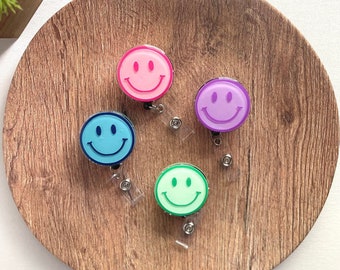 Smiley face badge reel