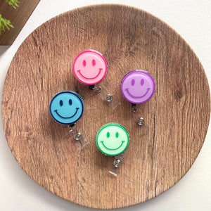 Smiley face badge reel