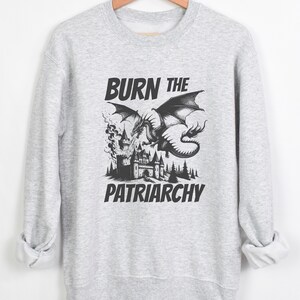 Burn The Patriarchy. Resistance vibes. for feminists and for those Who supports women's rights. Long sleeve crewneck pullover sweatshirt for women. very soft and comfortable choice. statement piece for everyday wear.