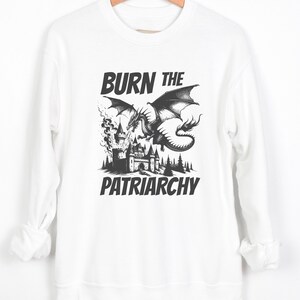 Burn The Patriarchy. Resistance vibes. for feminists and for those Who supports women's rights. Long sleeve crewneck pullover sweatshirt for women. very soft and comfortable choice. statement piece for everyday wear.