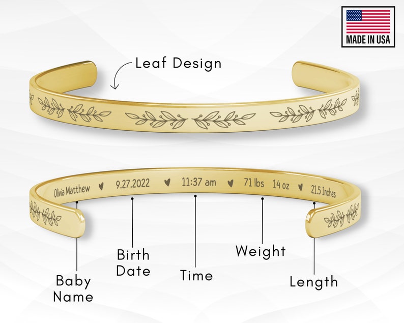 May include: Gold bangle bracelet with a leaf design engraved around the edge. The bracelet is personalized with the baby's name, birth date, time, weight, and length.  The text reads: Olivia Matthew 9.27.2022 11:37 am 71 lbs 14 oz 21.5 Inches