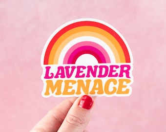 May include: A rainbow sticker with the text "Lavender Menace" in pink, orange, and yellow lettering.