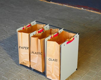 Eco friendly paper bag holder. Durable design, multiple sizes, waste, recycling, sustainable.