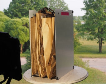Eco friendly paper bag holder. Durable design, multiple sizes, waste, recycling, sustainable.