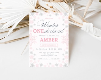 May include: A pink and gray invitation card with snowflakes and the text "Join us in a Winter Wonderland, Our Little Snowflake Amber is turning one!"  Saturday, December 21, 2pm. The Robertson Residence, 345 Blue Street, Southville, Jackson 6789. RSVP to Amber at 111-222-3333.