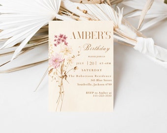 May include: A beige invitation card with a floral design in shades of pink, brown, and yellow. The text on the card reads "Amber's Birthday", "Please join us", "July 20 at 4pm", "Saturday", "The Robertson Residence", "345 Blue Street", "Southville, Jackson 6789", and "RSVP to Amber at 111-222-3333".