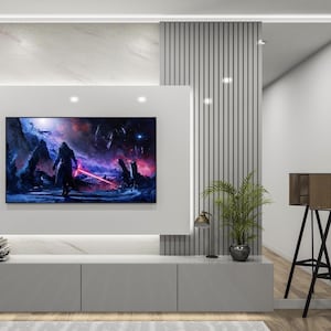 May include: A modern living room with a grey entertainment center featuring a flat screen TV playing a movie. The TV is mounted on a white wall with a grey marble accent wall behind it. A small potted plant sits on the entertainment center to the right of the TV. A black tripod stand with a brown speaker sits to the right of the entertainment center.