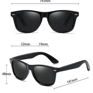 May include: Black sunglasses with a classic rectangular frame. The sunglasses have a 52mm lens width, 19mm bridge width, 147mm arm length, and 48mm height.