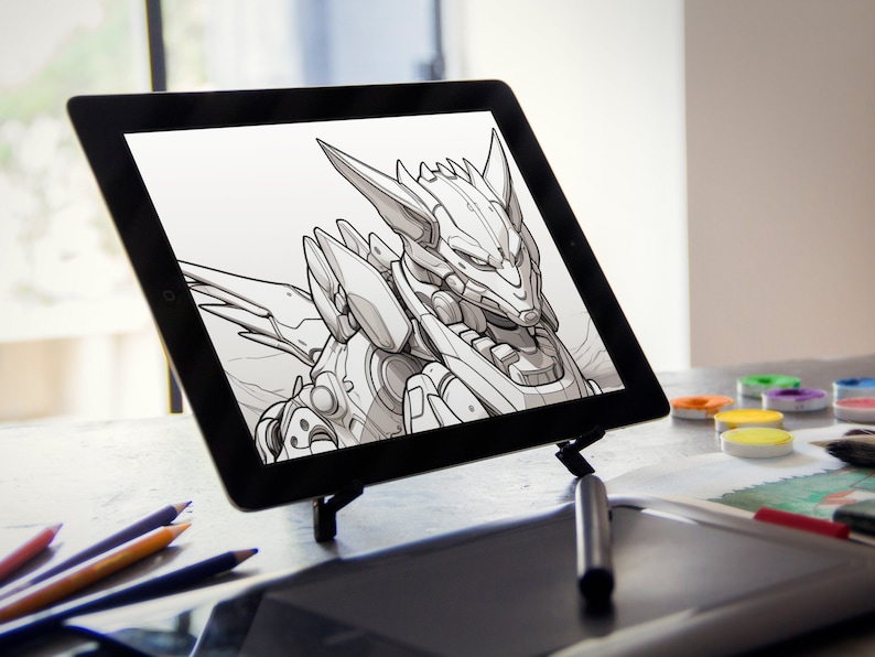 Może przedstawiać: Na tablecie cyfrowym wyświetlony jest czarno-biały rysunek robota z głową przypominającą wilka. Tablet leży na biurku ze stylusem, oł&oacute;wkami i zestawem farb akwarelowych.